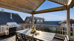 Beachside Retreat w/ Hot Tub, Balcony Dining & Blue-Ceiling Charm | Sea Cured by AvantStay