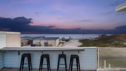 Oceanfront 2BR + Rooftop Deck, & Beach Access | Strand Way B