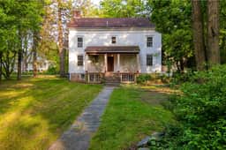 Relax in Style at Historic Modern on Main with Modern Amenities & Wooded Views