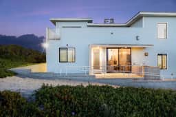 Oceanfront 2BR + Rooftop Deck, & Beach Access | Strand Way B