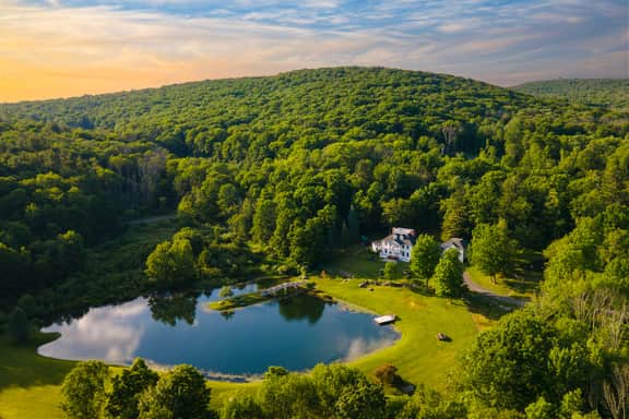 Secluded Estate • Optional Guest House, Pond, Playroom, Gym & Theater | Sunny Pond by AvantStay