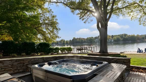 Lake Norman Lakefront w/ Private Beach, Dock, Hot Tub & Fire Pit | Sandy Shore by AvantStay