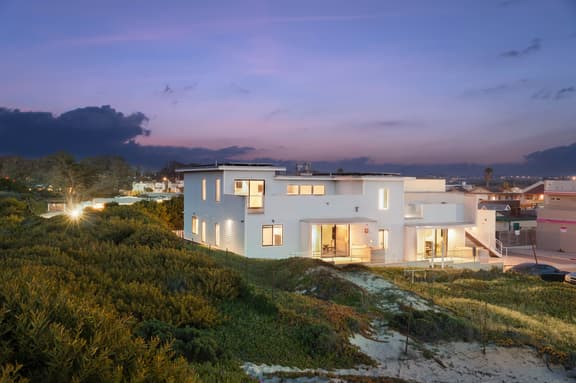 Oceanfront 2BR + Rooftop Deck, & Beach Access | Strand Way B